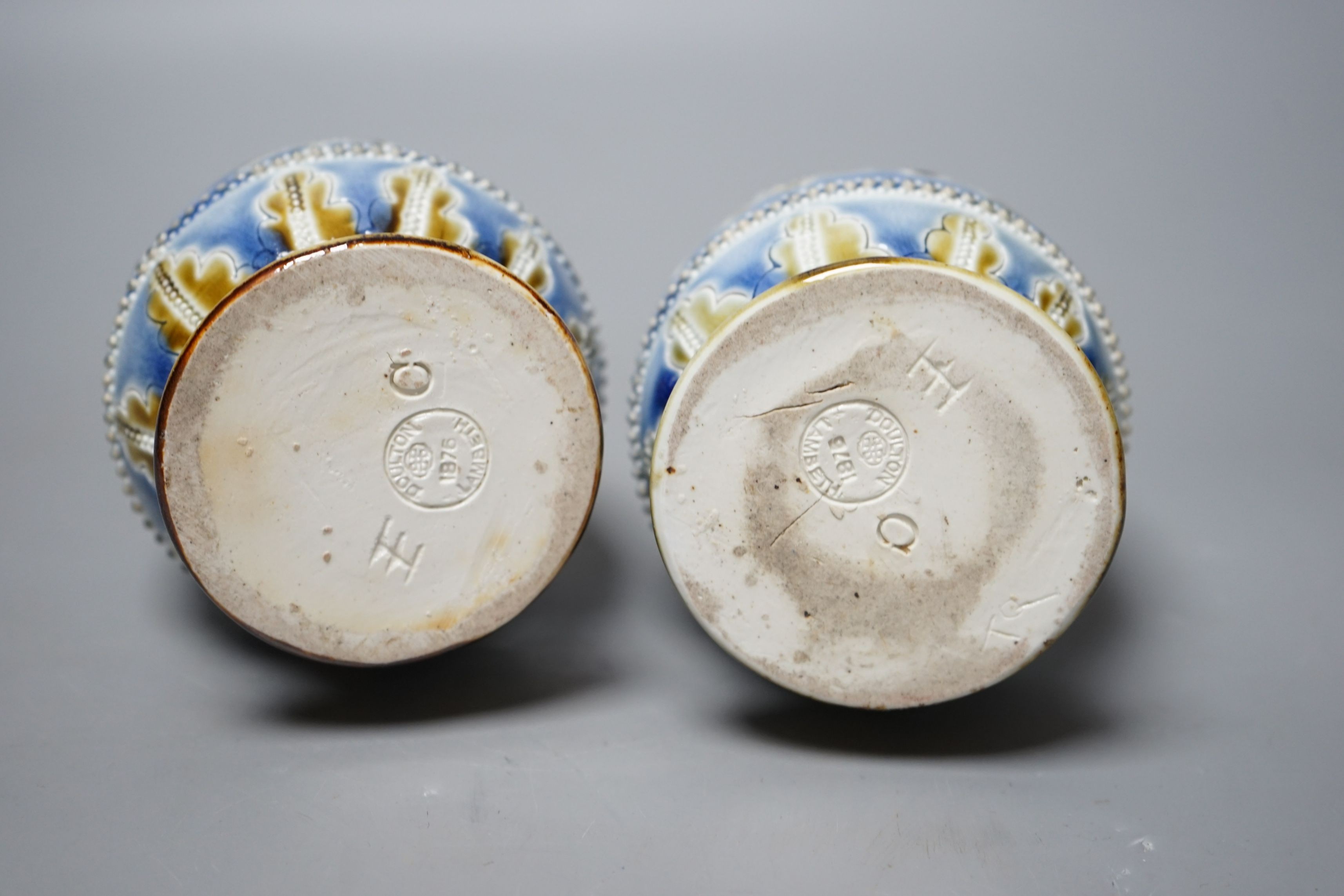 George Tinworth, a pair of Doulton Lambeth vases, stamped 1876, 20cm high